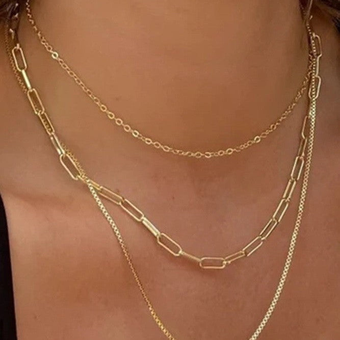 18K gold layered link and box chain necklace worn on model