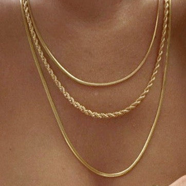18K gold layered snake and rope chain necklace worn on model