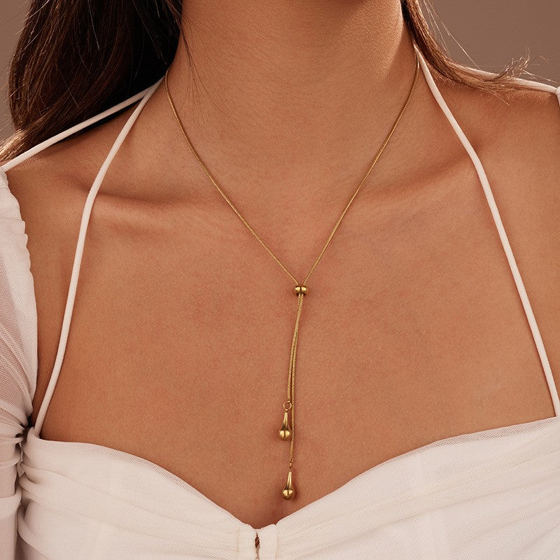 18K gold teardrop Y necklace worn on model