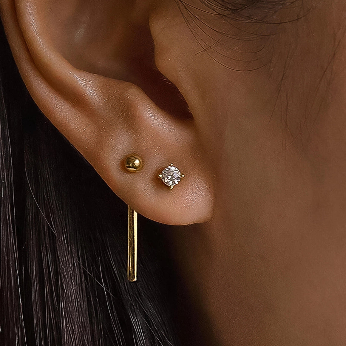 Belle 18K gold CZ chain drop earring set worn on model