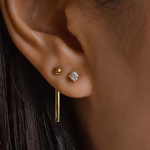 Belle 18K gold CZ chain drop earring set worn on model