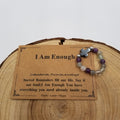 I Am Enough Labradorite Fluorite Amethyst Cross Ring with affirmation card on wood display