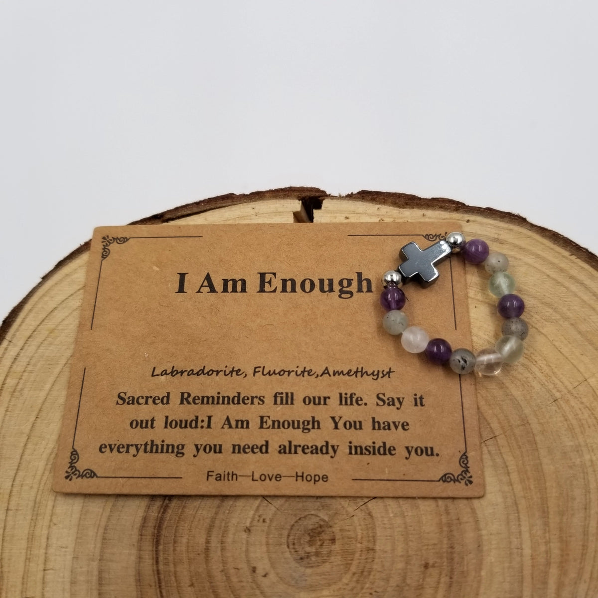 I Am Enough Labradorite Fluorite Amethyst Cross Ring with affirmation card on wood display