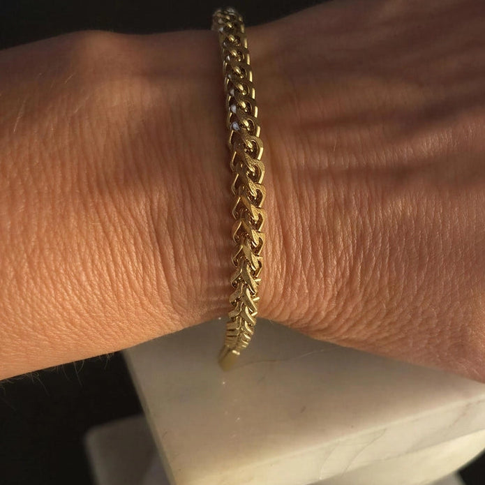 Liam Heritage Link Bracelet in gold-tone stainless steel worn on wrist