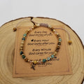 Nova Cross Mini Natural Stone Bead Bracelet Brown with Blessing Card on wood display