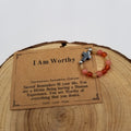 I Am Worthy Carnelian Sunstone Citrine Cross Ring with affirmation card on wood display