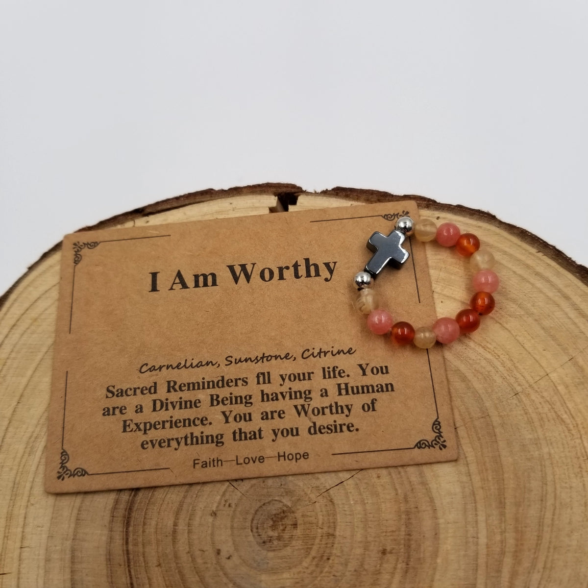 I Am Worthy Carnelian Sunstone Citrine Cross Ring with affirmation card on wood display