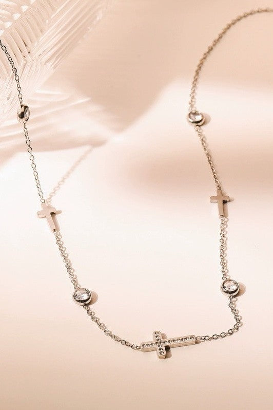 Silver rhinestone cross and circular charm station necklace