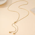 18K gold stainless steel teardrop Y necklace flat lay